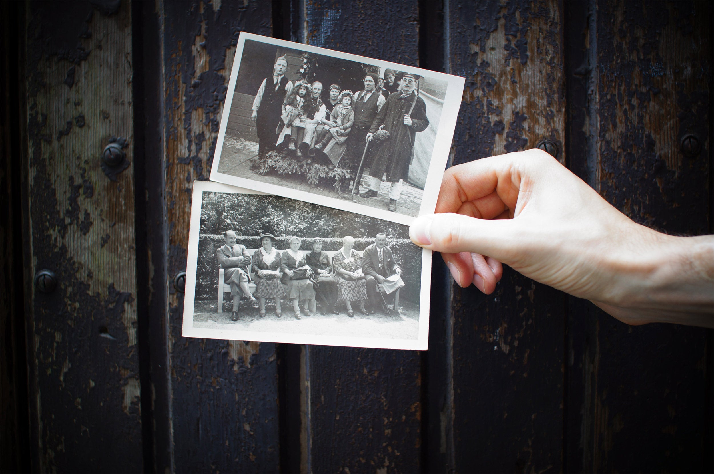 Hand holding old photographs